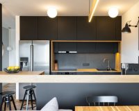 black-wooden-furniture-and-an-industrial-lamp-above-a-coffee-mac-1024x682