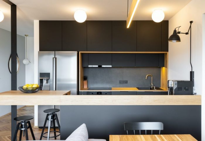 black-wooden-furniture-and-an-industrial-lamp-above-a-coffee-mac-1024x682
